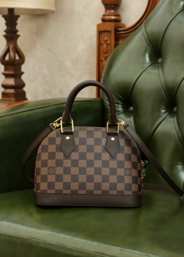 Louis Vuitton's four houses brown handbag